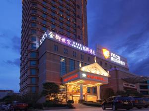 a building with a sign on top of it at Vienna Hotel Foshan Nanzhuang Avenue in Foshan