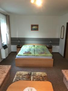A bed or beds in a room at Privát Magdalena