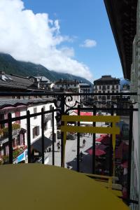 a view of a city from a balcony at Appartement Paccard, Centre Ville in Chamonix-Mont-Blanc