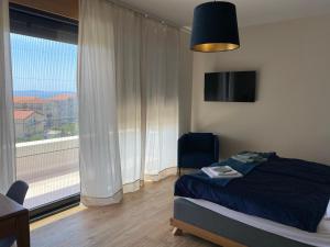 Postel nebo postele na pokoji v ubytování Quiet family Villa Anne, Podstrana + 37 fotografií