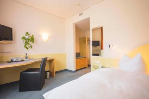 Postel nebo postele na pokoji v ubytování Hotel Luise