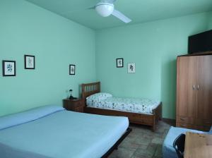 Postel nebo postele na pokoji v ubytování Agriturismo Vignarello