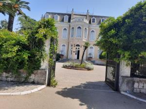 an entrance to a large house with a gate at Apartments Katarina in Bar