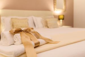 Voodi või voodid majutusasutuse Arcobaleno Suites toas
