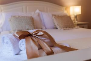 Voodi või voodid majutusasutuse Arcobaleno Suites toas