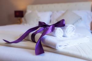 Voodi või voodid majutusasutuse Arcobaleno Suites toas