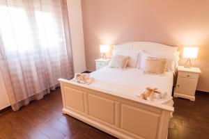 Voodi või voodid majutusasutuse Arcobaleno Suites toas