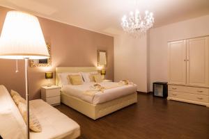 Voodi või voodid majutusasutuse Arcobaleno Suites toas