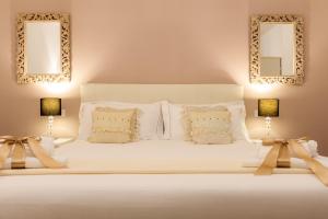 Krevet ili kreveti u jedinici u objektu Arcobaleno Suites