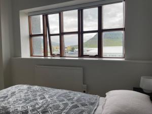 Ліжко або ліжка в номері Helgrindur Guesthouse