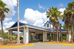 a large building with a large canopy on top of it at One Way Maingate in Kissimmee