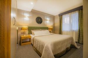 A bed or beds in a room at La Palace Exclusive Design
