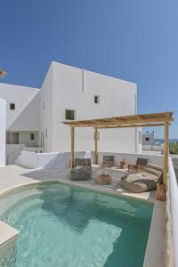 a swimming pool in front of a house at Ruby of Naxos in Agios Prokopios