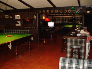a room with a pool table and a bar at Quinta Da Penha De Franca in Funchal