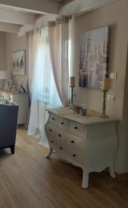 a living room with a dresser and a window at Villa Corte at Via Roma - Apartments with a View in Villa Latina