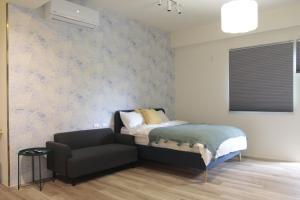 Posteľ alebo postele v izbe v ubytovaní 嫚悅文旅
