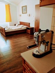 a kitchen with a sewing machine on a counter at Dvůr U kapličky in Žďár nad Sázavou