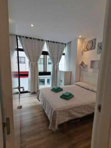 Posteľ alebo postele v izbe v ubytovaní Apartamento Carreira Sada
