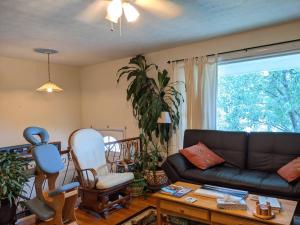 a living room with a couch and a chair at Fairhaven Guesthouse in Charlottesville