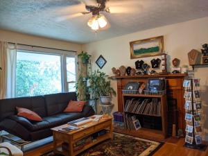 a living room with a couch and a table at Fairhaven Guesthouse in Charlottesville