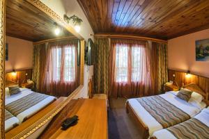 Postel nebo postele na pokoji v ubytování Hotel Victoria