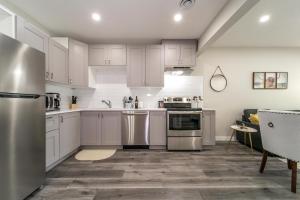 A kitchen or kitchenette at Modern Oasis Guest Suite I Walk out Patio I WEM I WiFi!