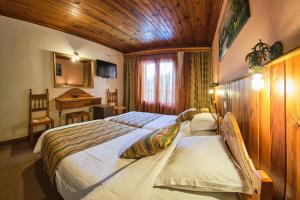 Postel nebo postele na pokoji v ubytování Hotel Victoria
