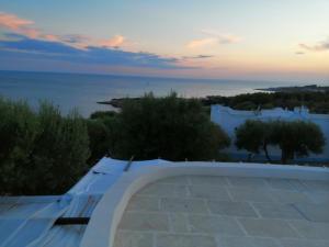 a view of the ocean from the roof of a house at Santa Maria de Lu Trisciulu in Castrignano del Capo