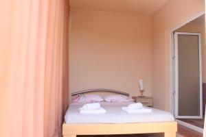 Postel nebo postele na pokoji v ubytování Apartment Luce