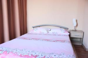 Postel nebo postele na pokoji v ubytování Apartment Luce