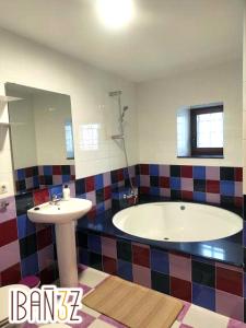 a bathroom with a tub and a sink at Ibañez 3 in Ribadeo +10 photos