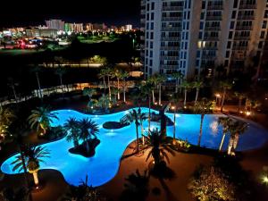 an aerial view of a pool at night at 1815 A Slice of Heaven Destin - Pool & Ocean View in Destin