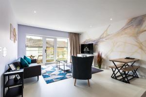 a living room with a couch and a table at Stay for Work - Spotless and Stress-Free - Apartment 5 in Gillingham