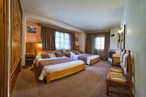 Postel nebo postele na pokoji v ubytování Hotel Victoria