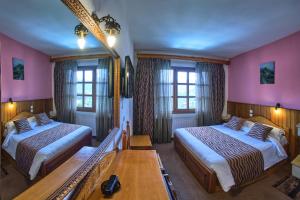 Postel nebo postele na pokoji v ubytování Hotel Victoria
