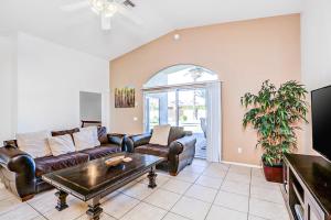 a living room with a couch and a table at Tranquil Times in Palm Desert