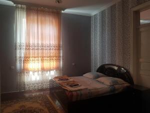 Postel nebo postele na pokoji v ubytování Guest House Adigeni