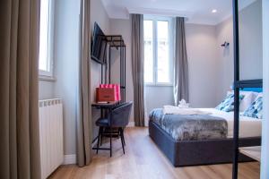 Posteľ alebo postele v izbe v ubytovaní AD Suites Tritone + 37 fotografií