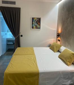 Ein Bett oder Betten in einem Zimmer der Unterkunft HOTEL Boutique ÁNGEL