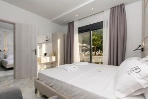 Posteľ alebo postele v izbe v ubytovaní B&D Luxury Suites