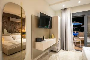 Televízia a/alebo spoločenská miestnosť v ubytovaní B&D Luxury Suites