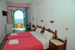 Posteľ alebo postele v izbe v ubytovaní Erofili Rooms