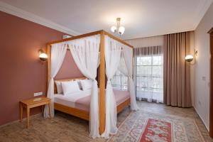 Vuode tai vuoteita majoituspaikassa Kairos Hotel