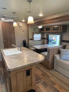 a kitchen and living room of an rv at Cozy Camper in Miami