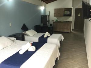 Letto o letti in una camera di Apartahotel Avanti
