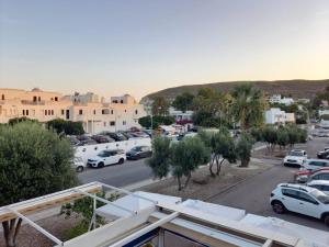 a view of a parking lot with cars parked at Agua Amarga Design in Agua Amarga