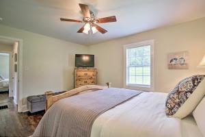 a bedroom with a bed and a ceiling fan at Idyllic Getaway with Deck about 4 Mi to Dtwn Athens in Athens