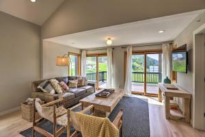 a living room with a couch and a table at Evergreen Mountain Duplex on I70 with Trail Access! in Idaho Springs