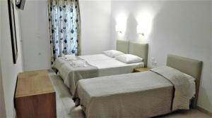 Posteľ alebo postele v izbe v ubytovaní Anatoli Rooms