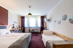 Postel nebo postele na pokoji v ubytování Flair Hotel Zur Eiche + 37 fotografií